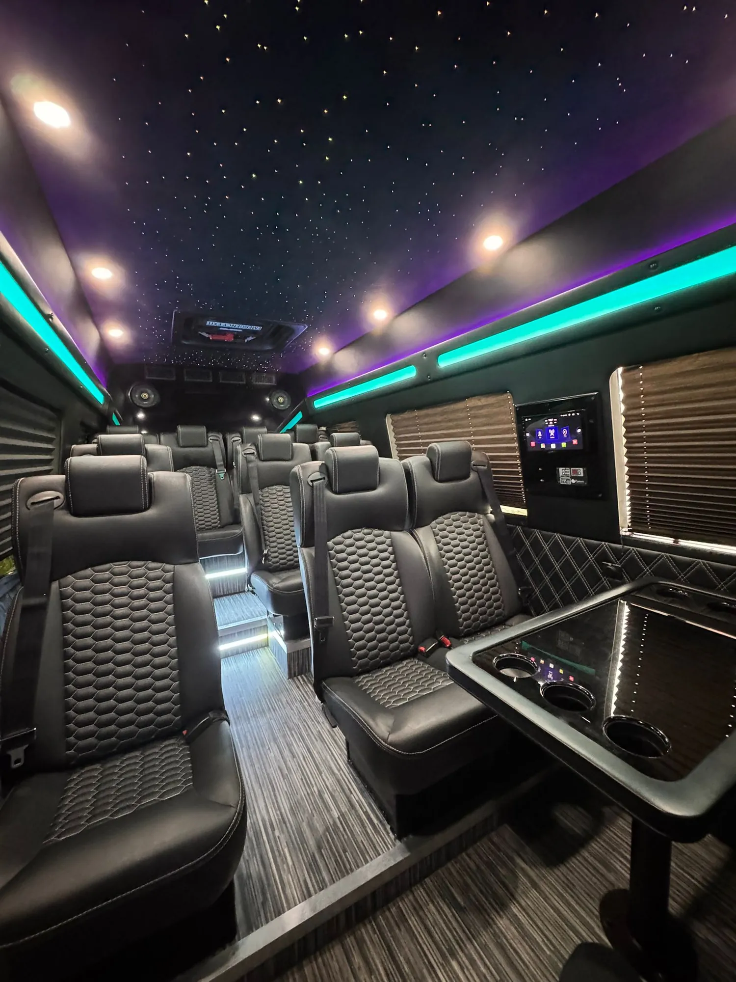 Executive Sprinter quilted seats beside dark window shades — Minibus Rental NYC by Sprinter Van with Driver