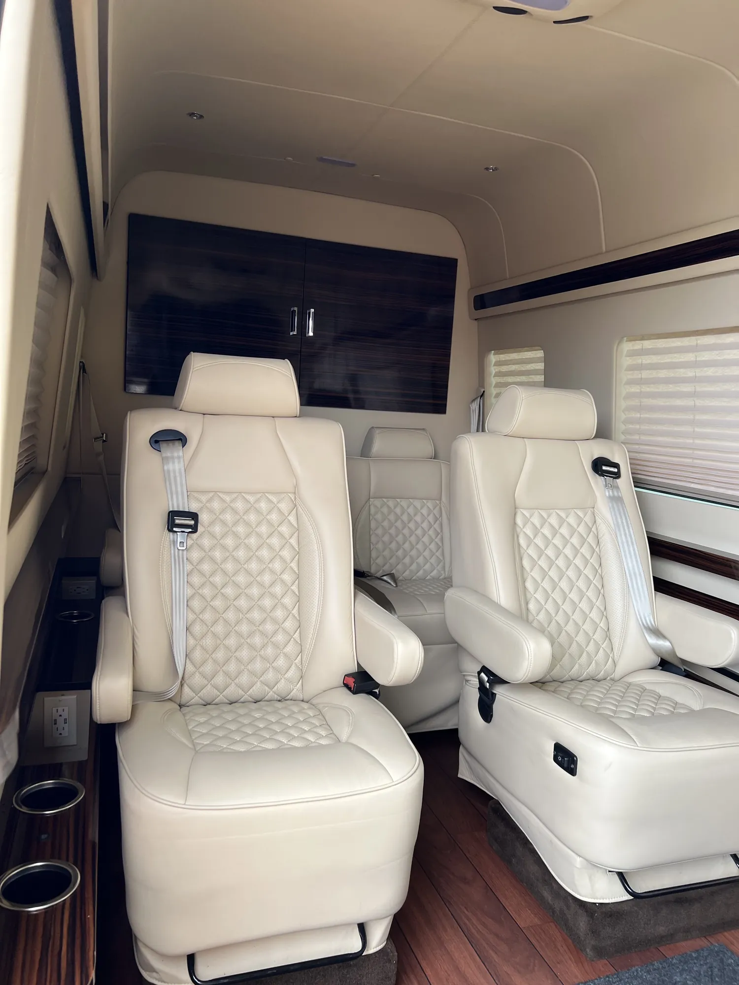 Jet Sprinter cream chairs viewed from the side entrance — Jet Sprinter NYC with Driver