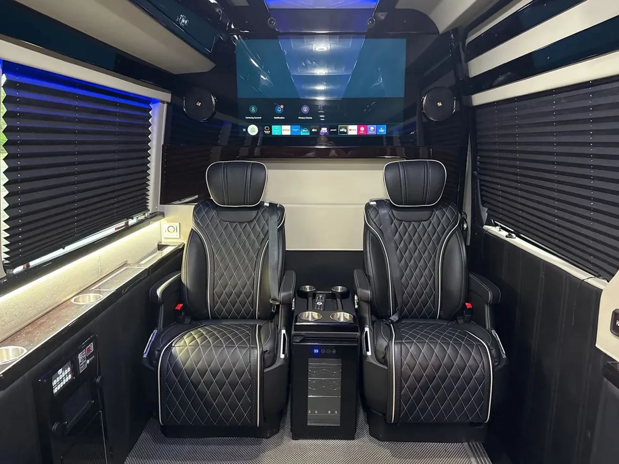 Jet Sprinter dark quilted chairs and window shades — Contact NYC Sprinter Van